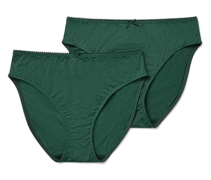 Két zöld, klasszikus szabású női alsó masnival fehér alapon.