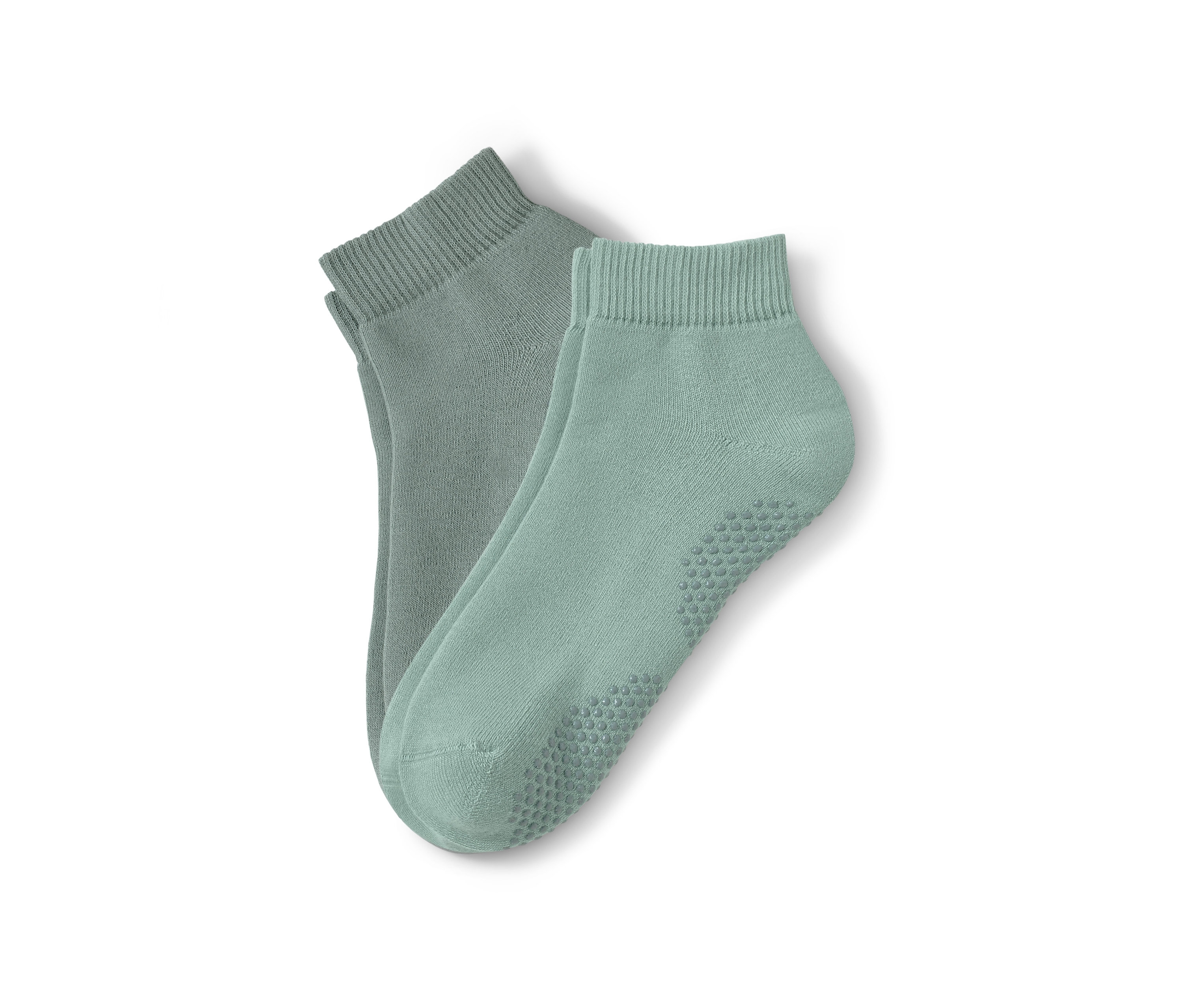 Két pár zöld jógazokni.