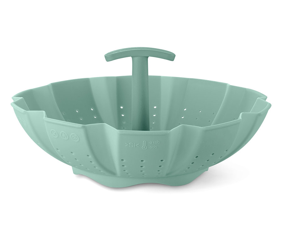 Egy zöld szilikon párolókosár fogantyúval a közepén.