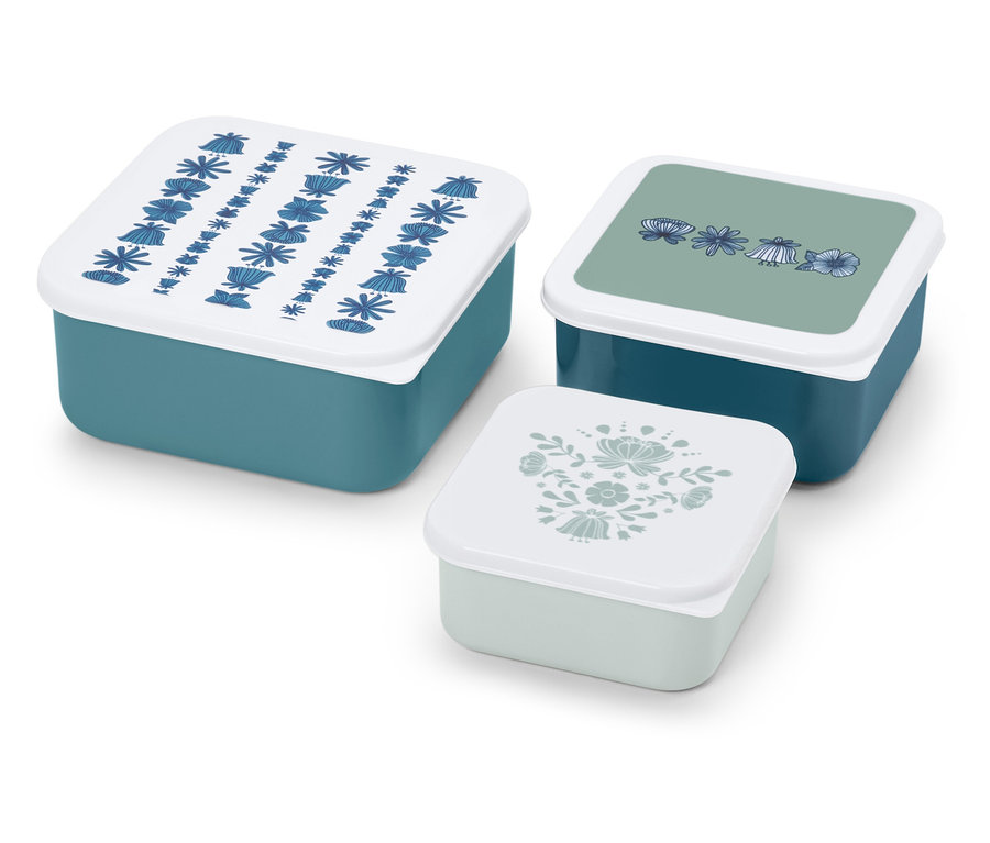 Egy készlet három kékeszöld uzsonnásdoboz virágmintákkal a fedelükön.