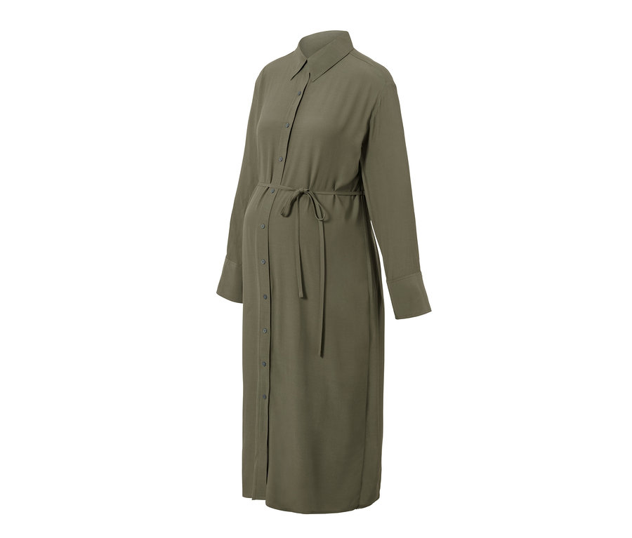 Egy olívazöld, hosszú ujjú, gombos kismama blúzruha látható.