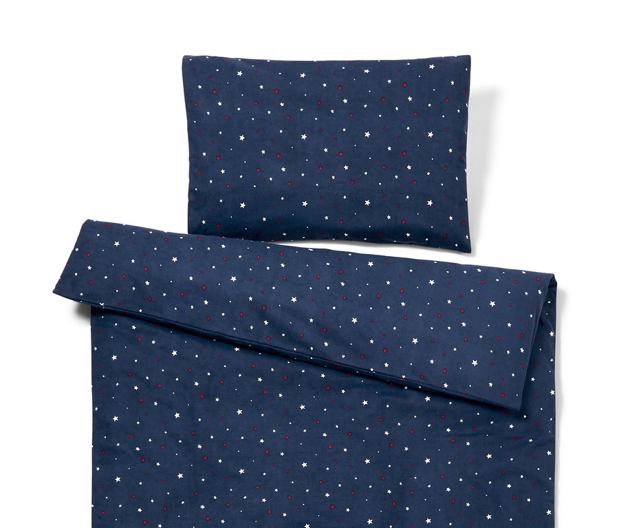 Pamutflanel gyerek ágynemű szett sötétkék háttérrel, fehér csillagokkal és piros pöttyökkel.