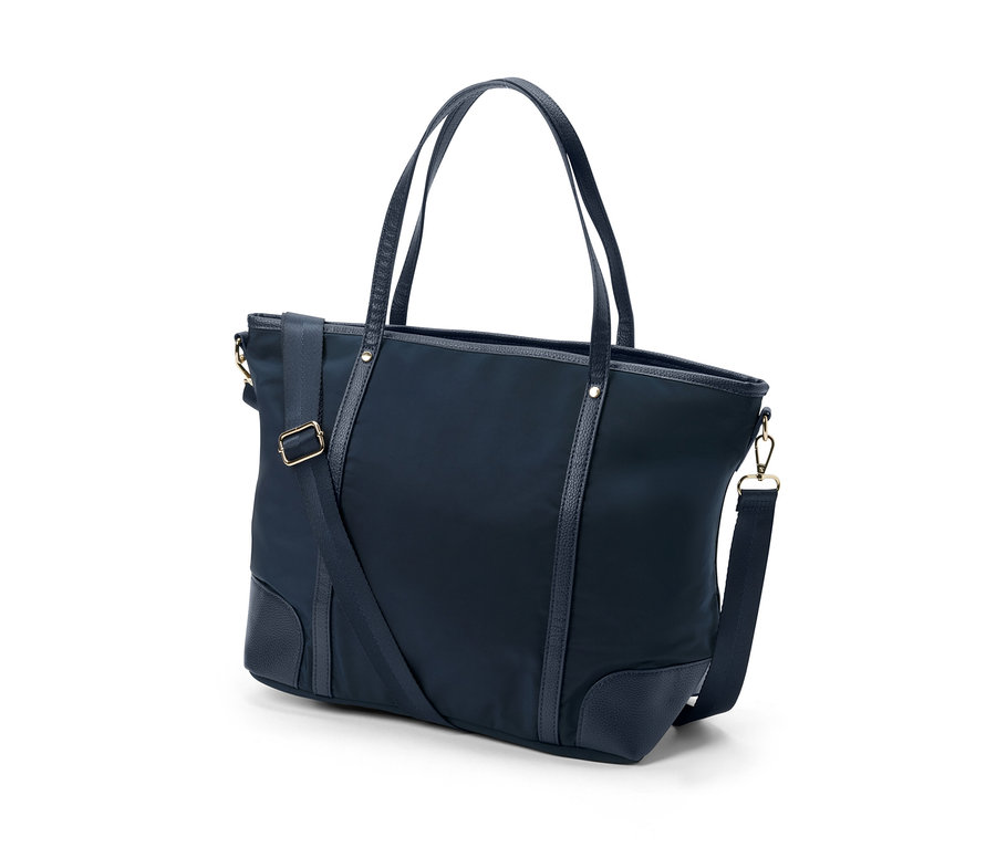 Egy sötétkék női shopper táska fogantyúkkal és vállpánttal.