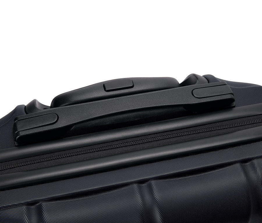 Egy fekete bőrönd közeli képe fogantyúval és cipzárral.