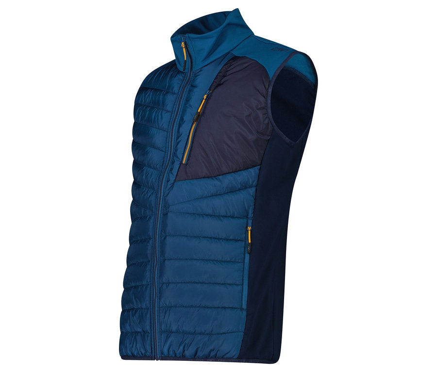 Egy tengerészkék steppelt mellény tengerészkék polárbetétekkel az oldalán és sárga cipzárakkal.