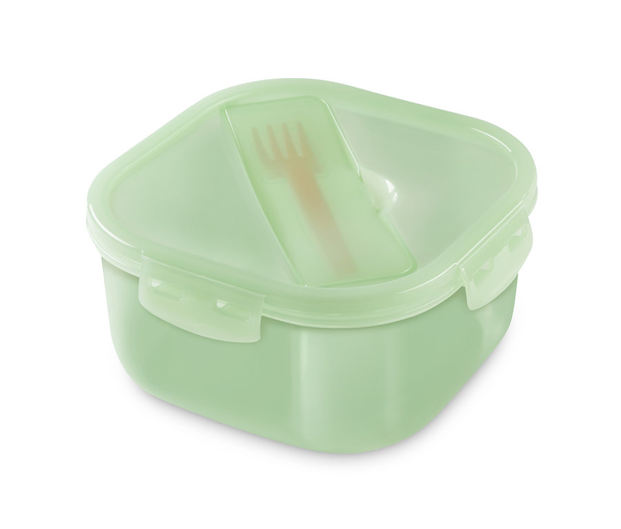 Egy zöld ételhordó doboz világosbarna villával a belsejében.