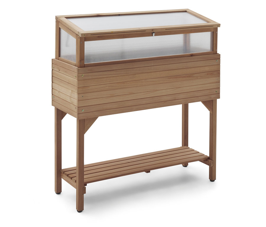 Egy fából készült üvegház átlátszó fedéllel és tároló polccal fehér alapon áll.