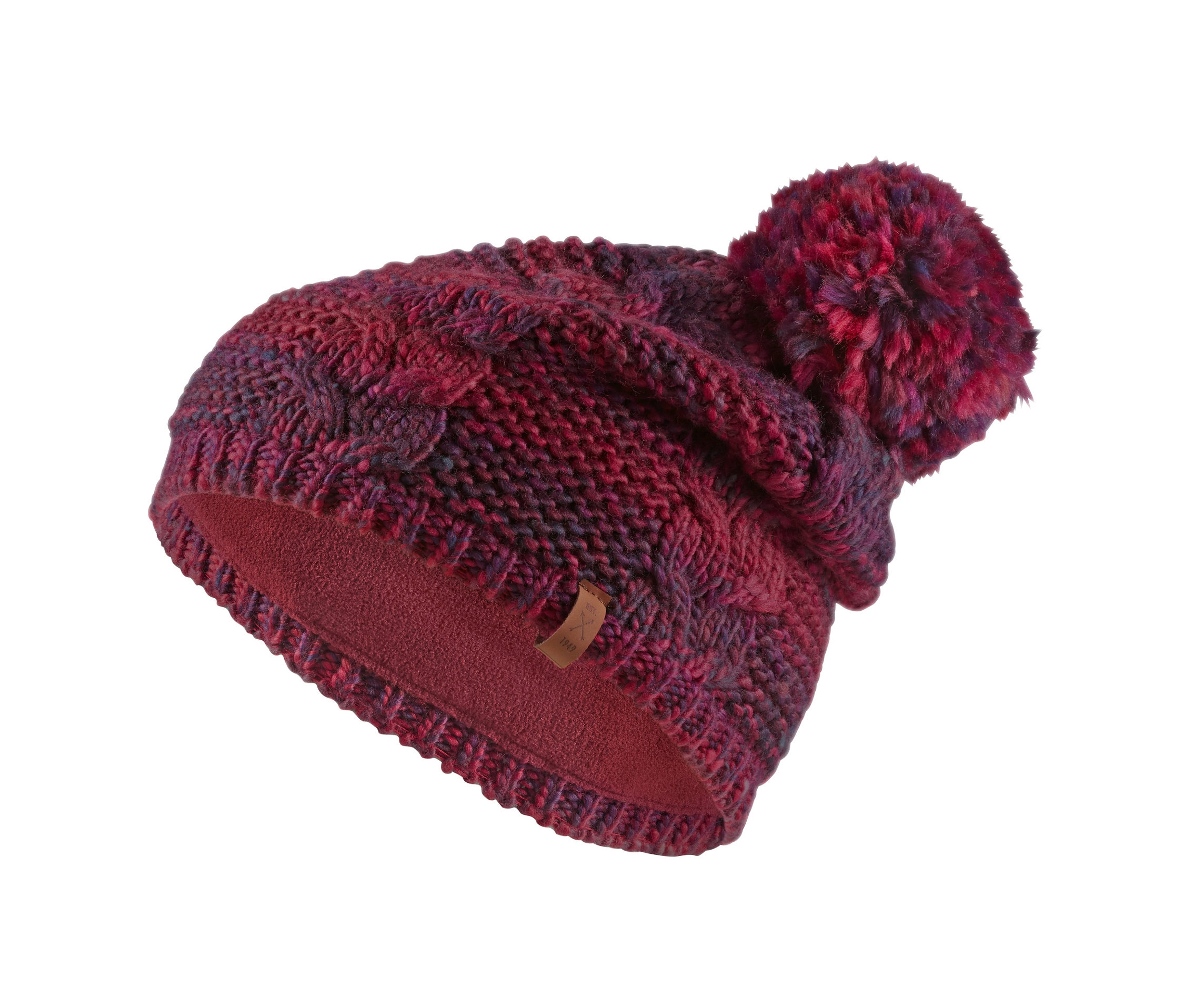 Egy kötött sapka részlete bojttal.