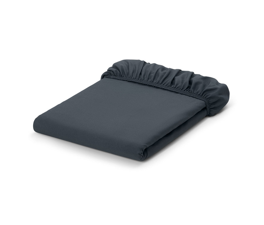 Egybehajtott szürke mikroszálas gumis lepedő.