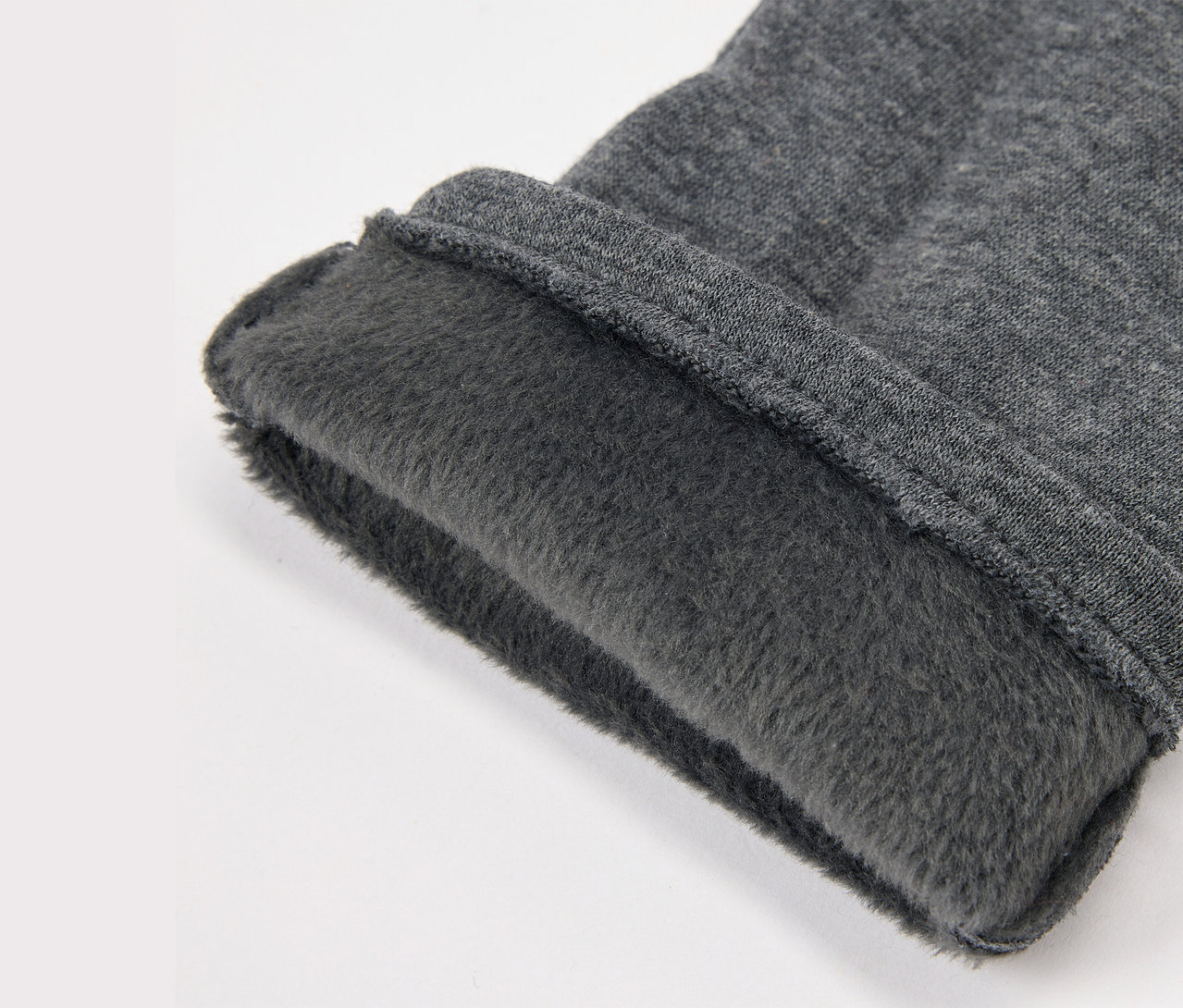 Szürke szövet részlete fleece béléssel.