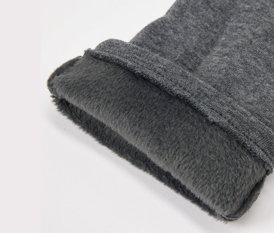 Szürke szövet részlete fleece béléssel.