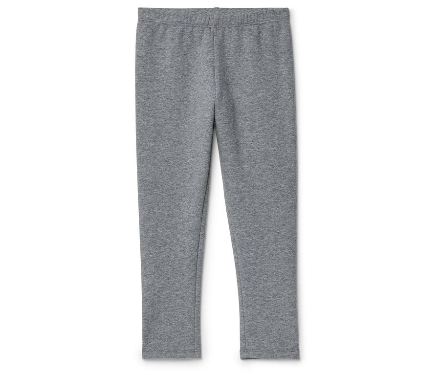 Szürke leggings fekszik egy fehér háttéren.