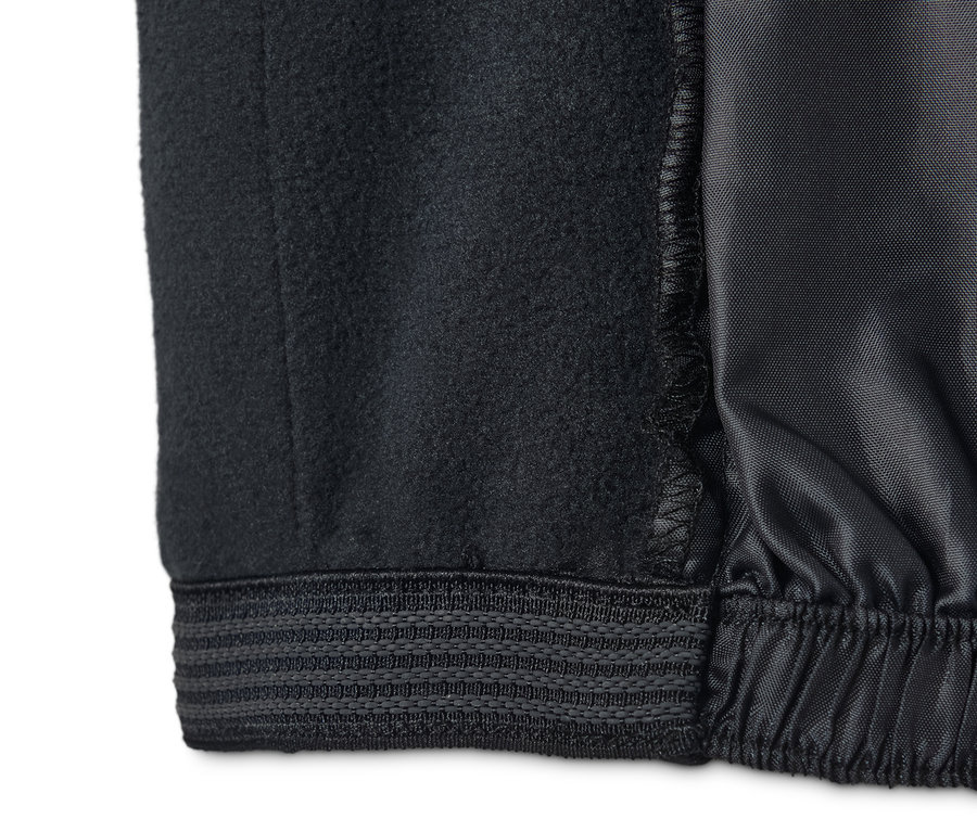 Egy fekete női softshell jet sínadrág részlete.