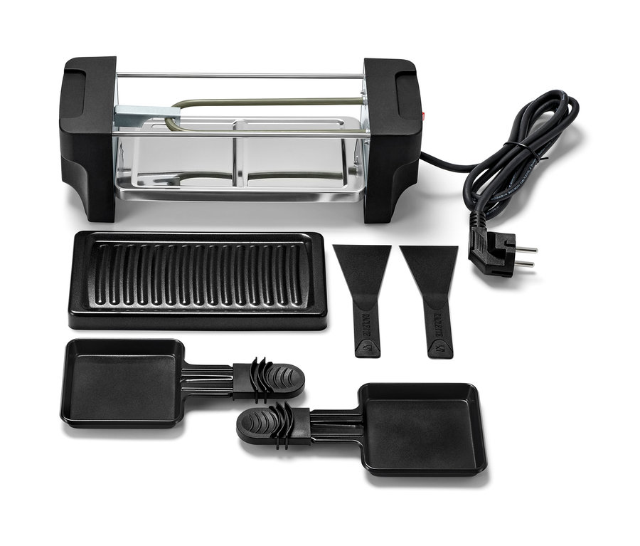 Kétszemélyes raclette szett grill-lappal, serpenyőkkel és spatulákkal.