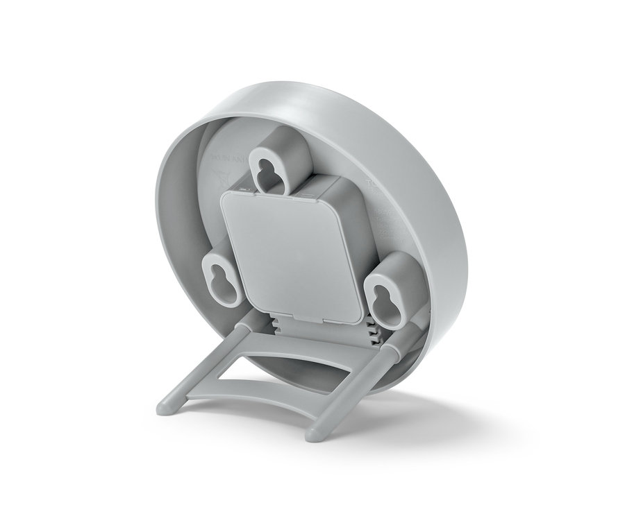 Egy szürke fürdőszobai falióra hátuljának részlete.