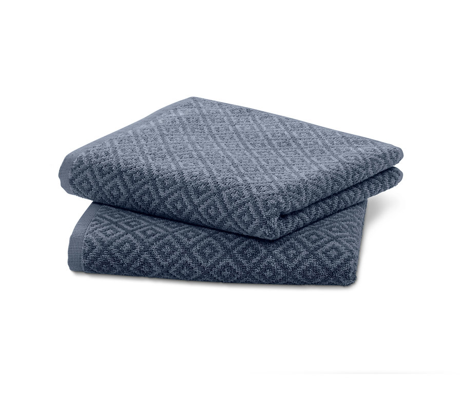 Két jacquard törölköző egymásra hajtva.