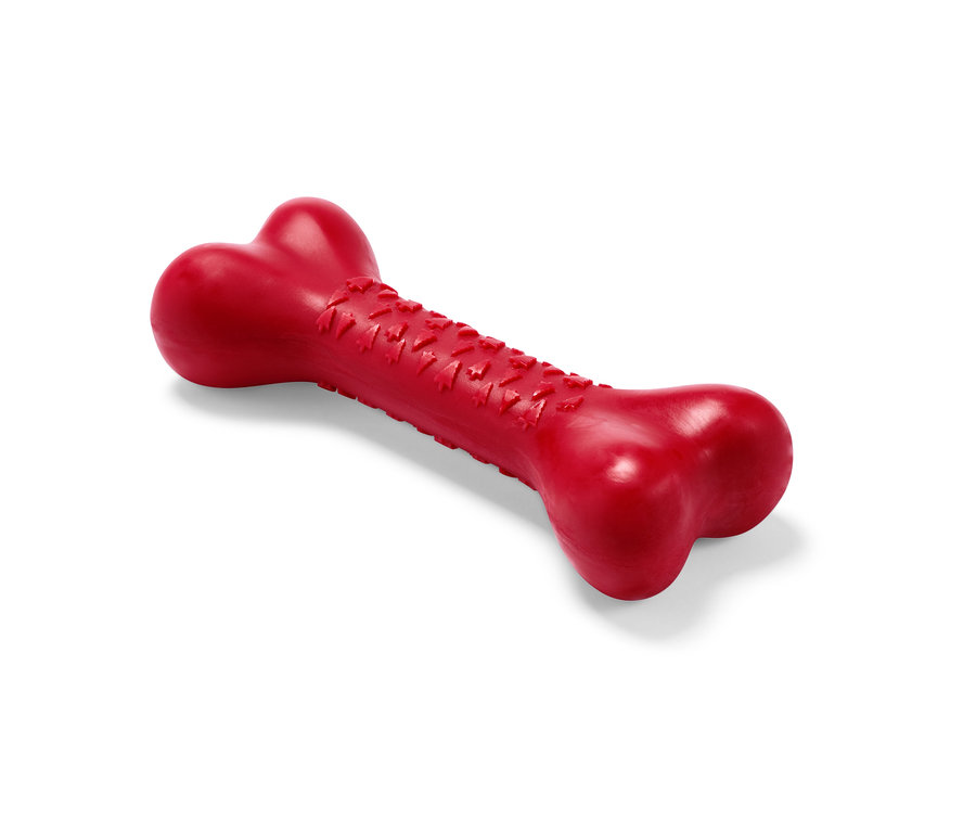 Egy piros, csont alakú kutyajáték.