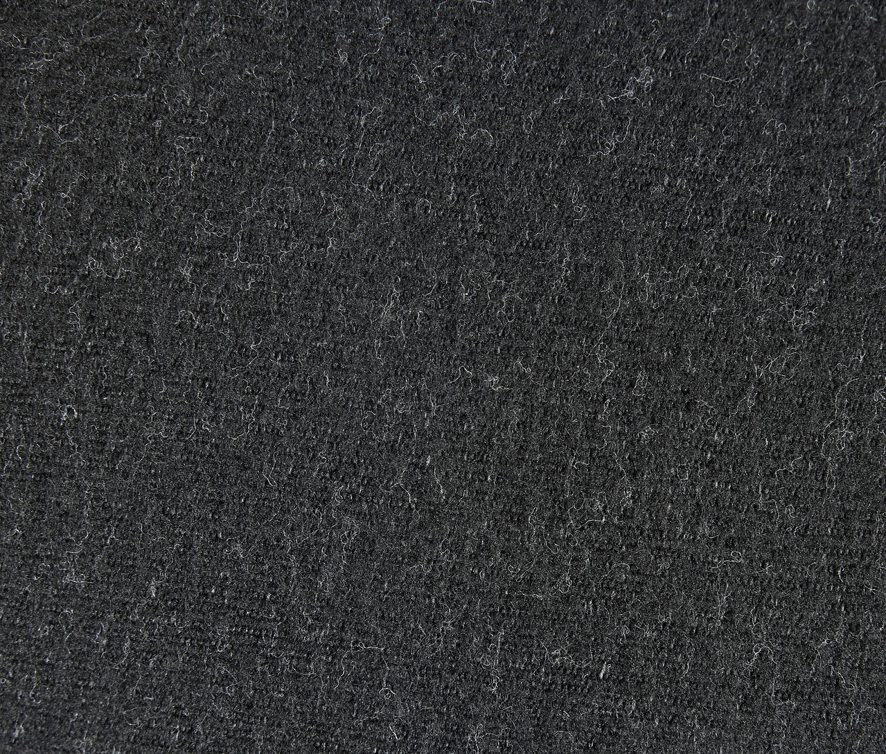 Egy szürke textil textúrájának közeli képe.