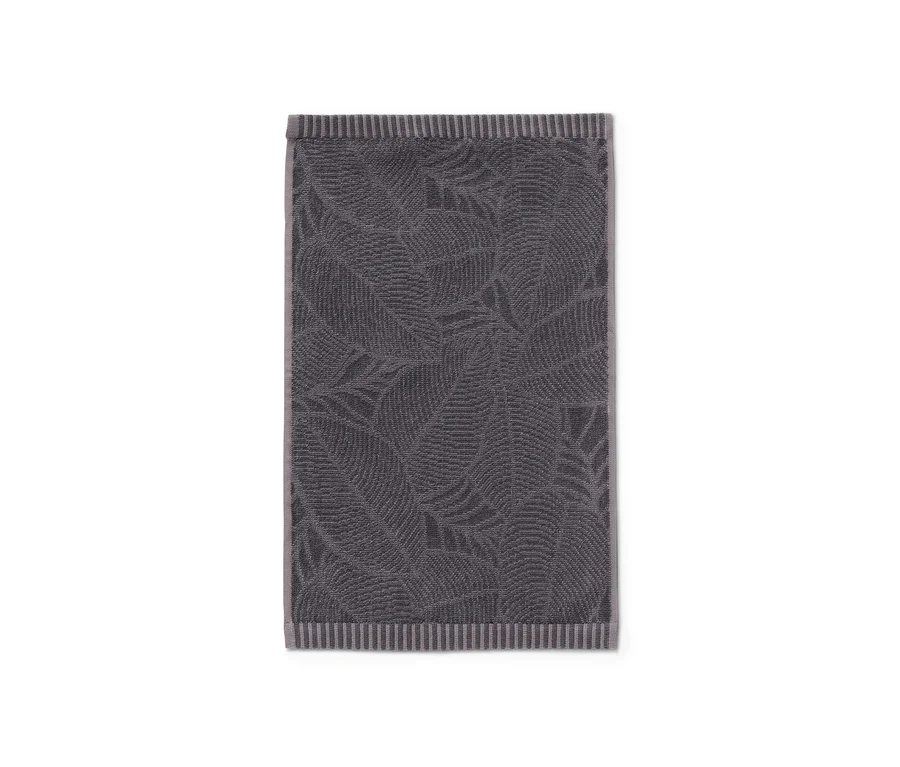 Egy antracit színű, leveles mintázatú jacquard vendégtörölköző.