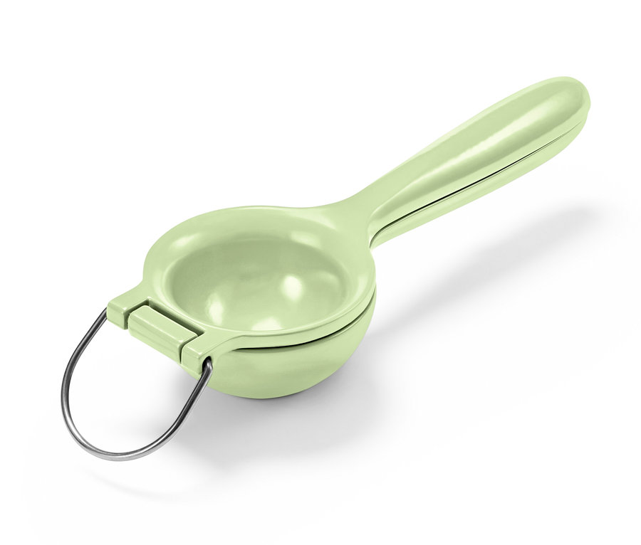 Egy zöld citrusprés.