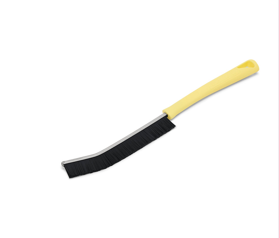 Sárga kefe fekete sörtékkel fehér háttéren.