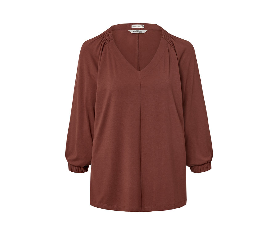 Terrakotta színű, húzott női felső V-nyakkivágással és hosszú ujjakkal.