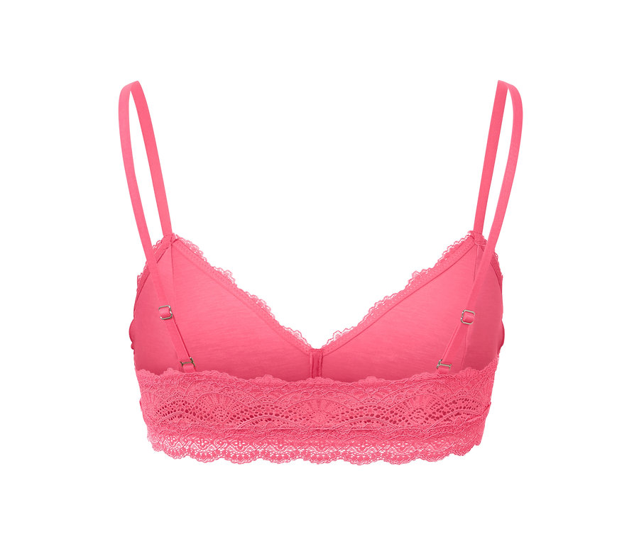Egy rózsaszín, csipkés női bustier melltartó közelről.
