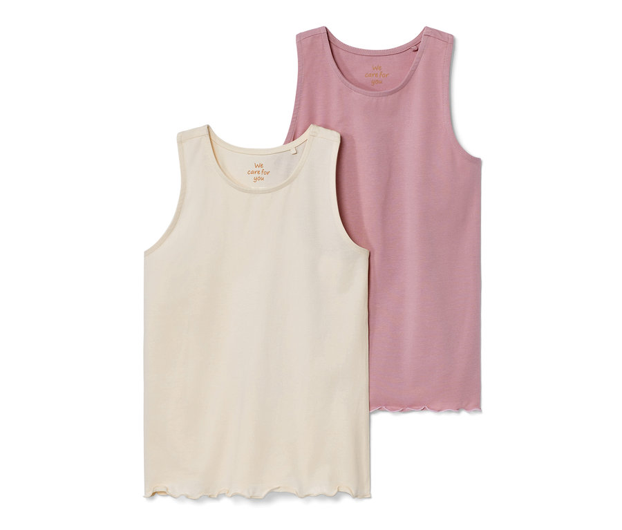 Két gyermek felső: egy krémszínű és egy rózsaszín.