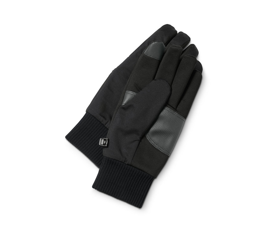 Két fekete softshell kesztyű fekszik egy fehér háttéren.