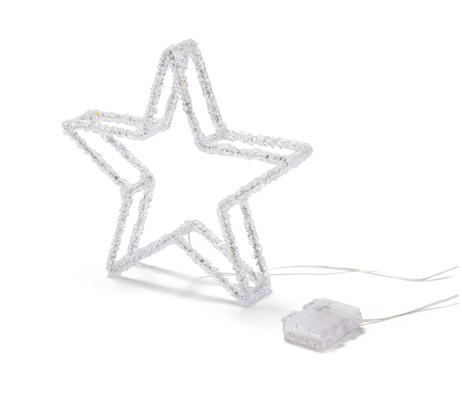 Egy LED-es dekorcsillag áll fehér háttér előtt.
