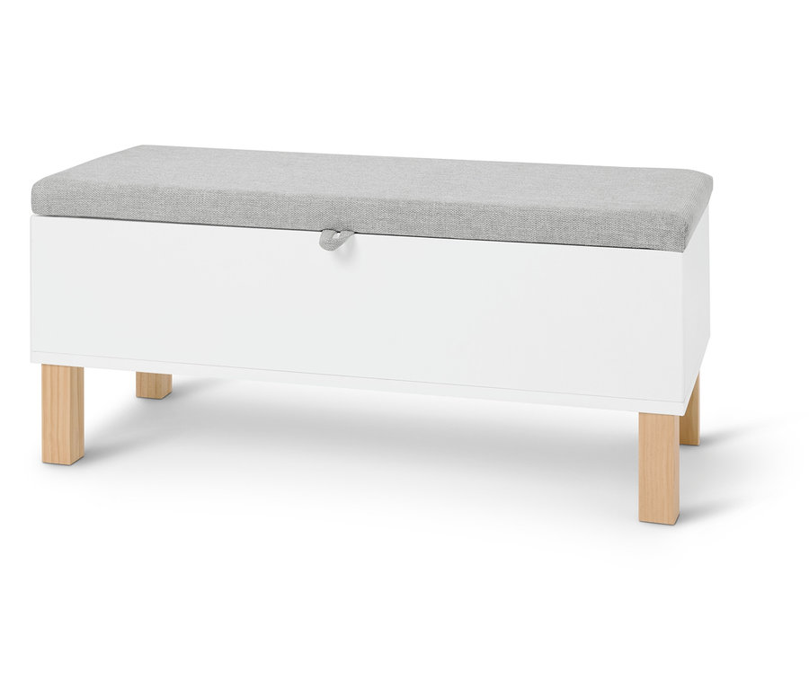 Fehér tárolópad világosszürke párnával világos háttér előtt.