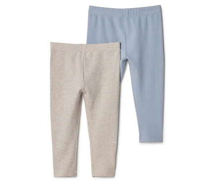 Két bordázott leggings közeli képe, egy bézs és egy kék színű.