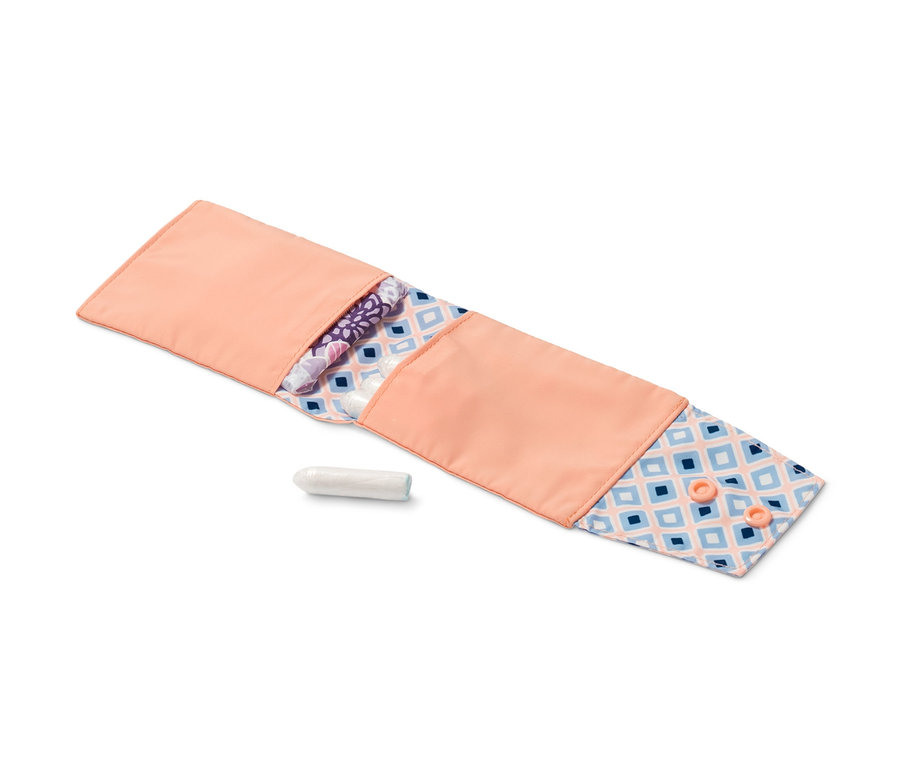 Nyitott, barack színű egészségügyi betét tartó betétekkel és tamponnal.