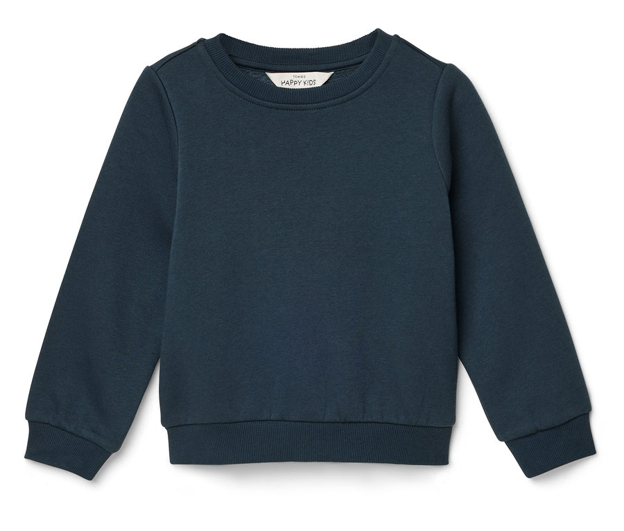 Kék gyerekpulóver fekszik egy fehér háttéren.