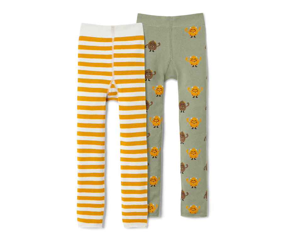 Két kötött leggings: egy fehér, sárga csíkokkal, a másik olívazöld, szörnymintával.
