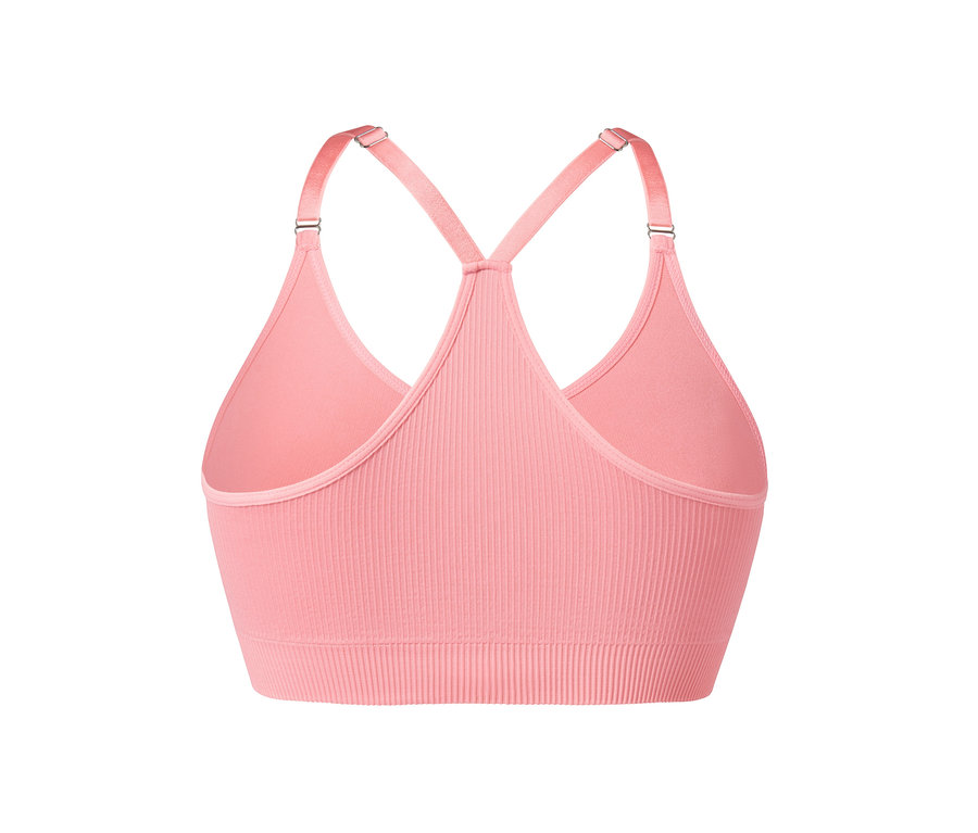 Közelkép egy rózsaszín női bustier sportmelltartóról.