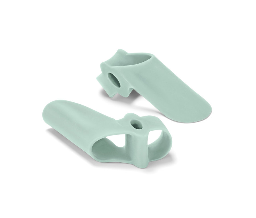 Két világoszöld bütyökvédő lábujjakra fehér alapon.