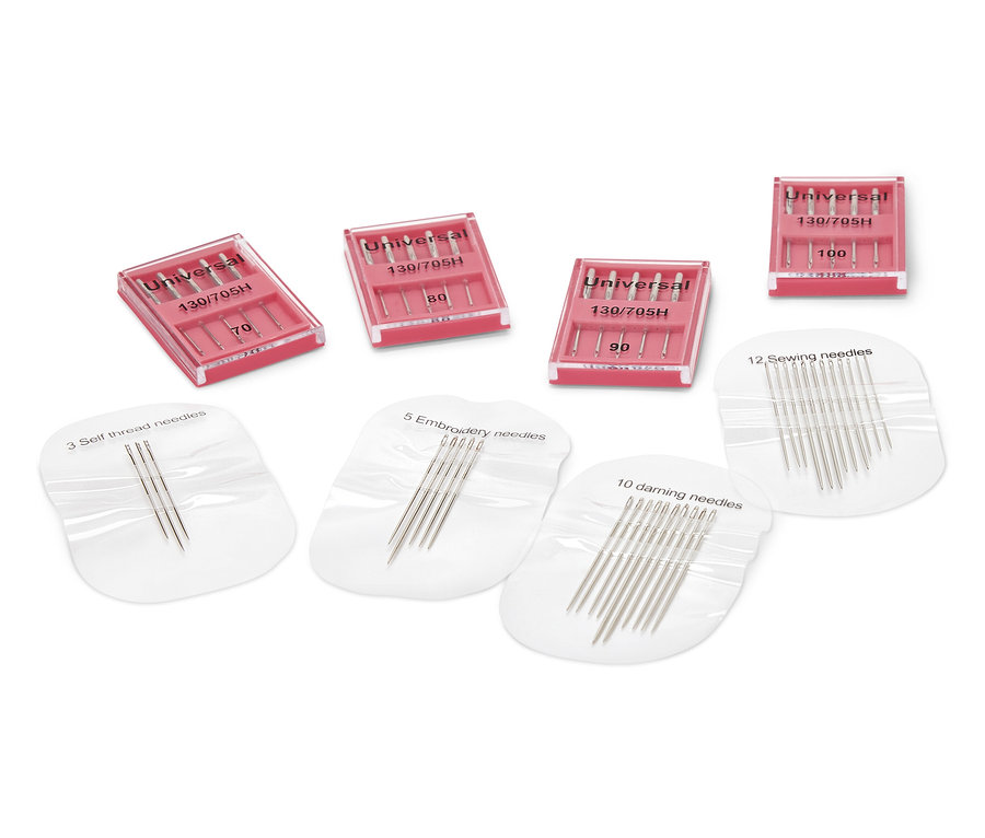 Varrógép- és tűkészlet: különféle tűk csomagolásban és tokokban.