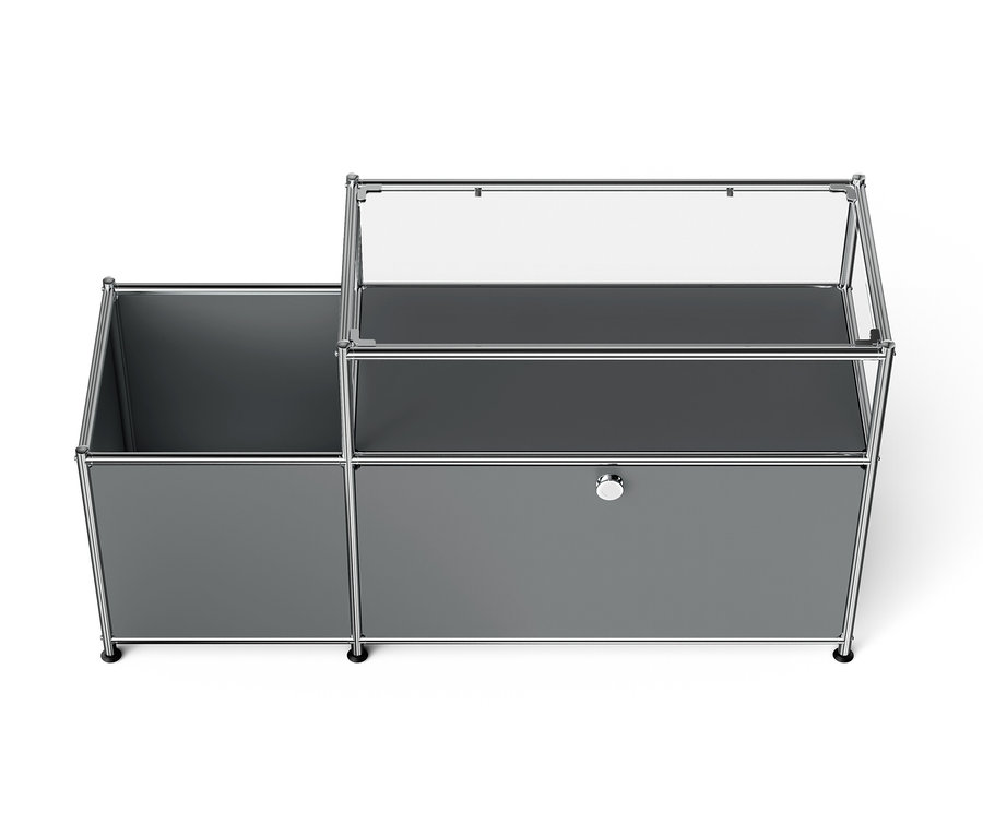 Szürke moduláris tárolórendszer nyitott rekesszel és fiókkal.