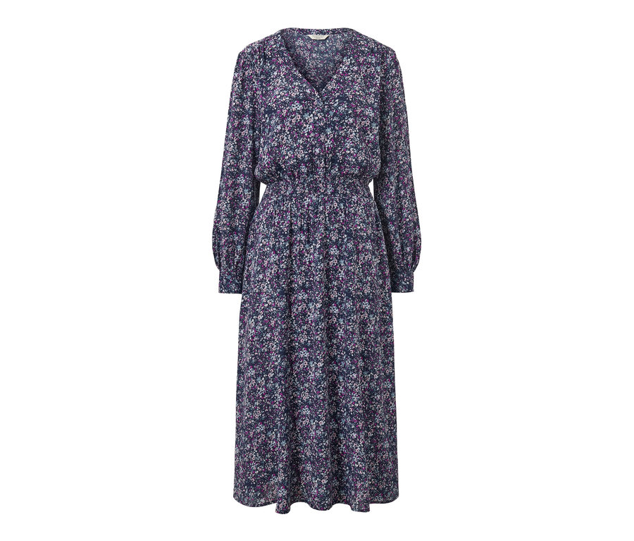 Teljes alakos kép egy virágos midiruháról.