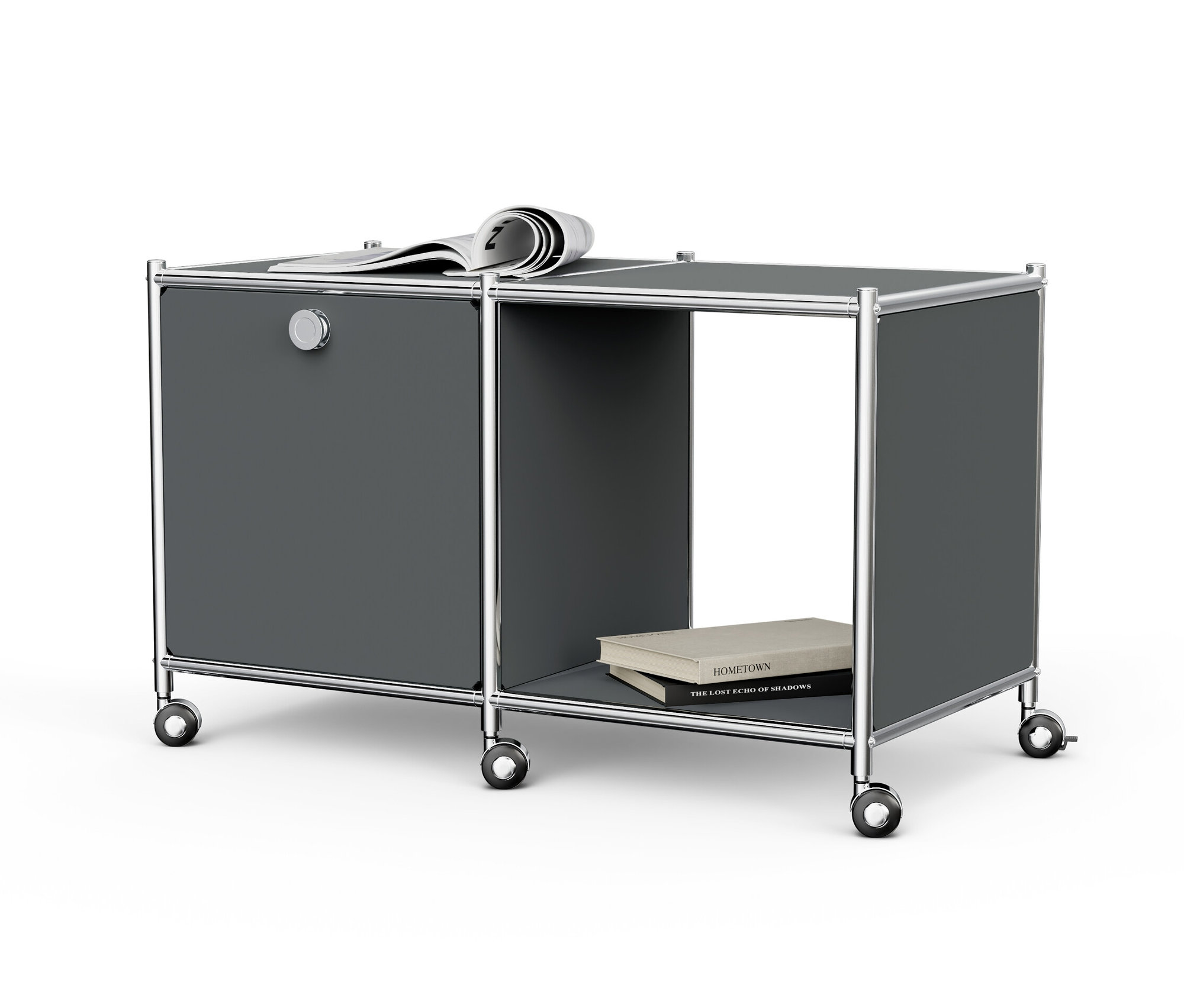 Szürke »CN3« fém kisasztal 1 lenyíló ajtóval, görgőkkel, újsággal a tetején és könyvekkel a nyitott rekeszben.