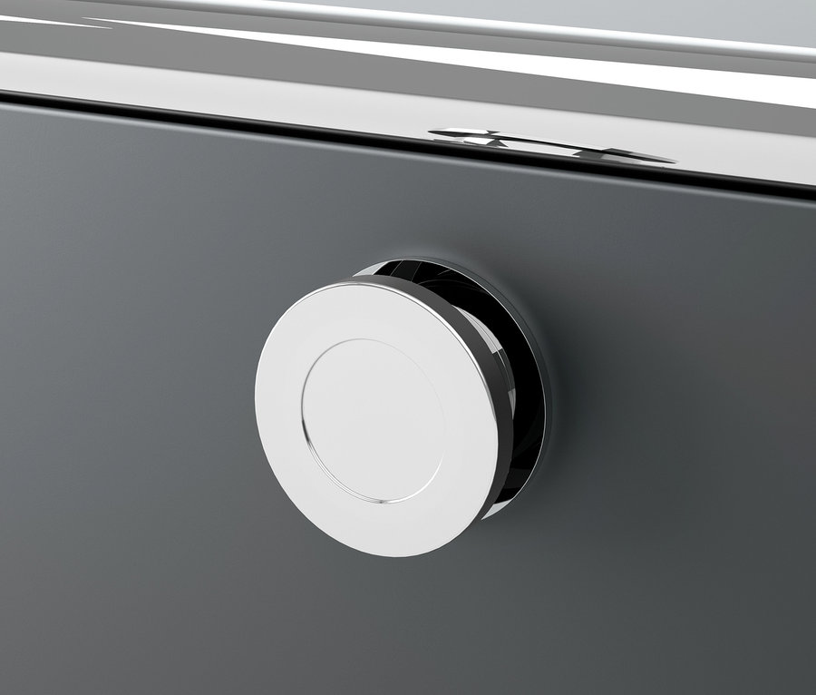 Egy szürke CN3 fém komód részlete, kerek, ezüst színű fogantyúval.