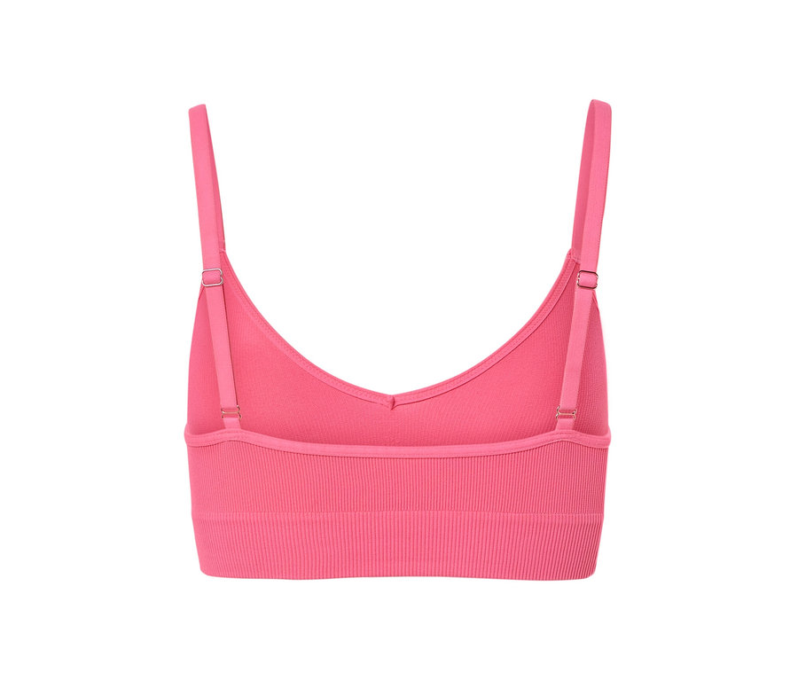 Egy rózsaszín női seamless bustier melltartó részlete.
