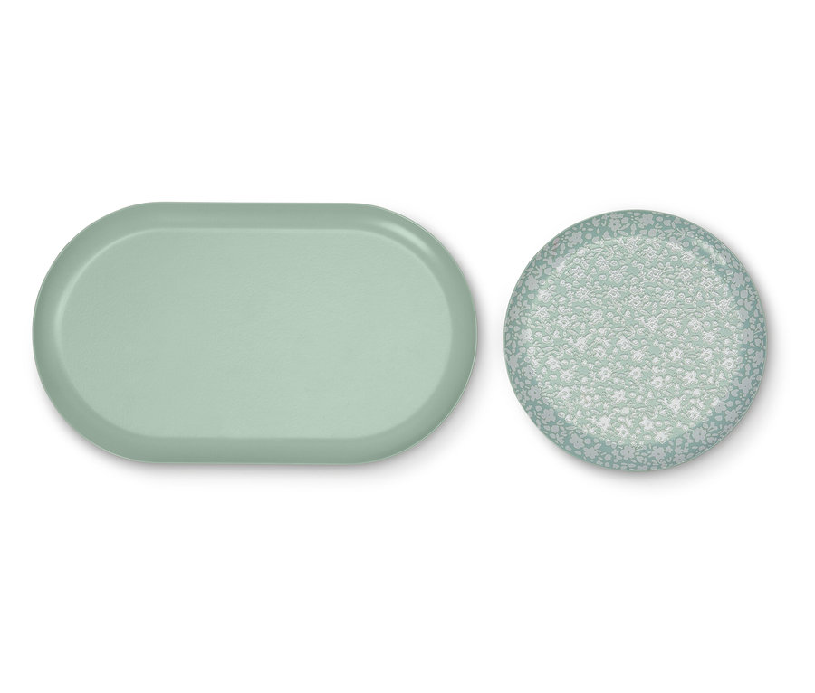 Egy világoszöld, ovális tálca és egy virágmintás, kerek tálca.