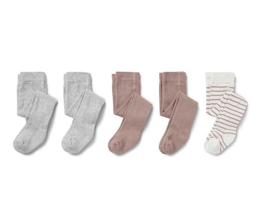 Három pár babaharisnya szürke, barna és csíkos színben.