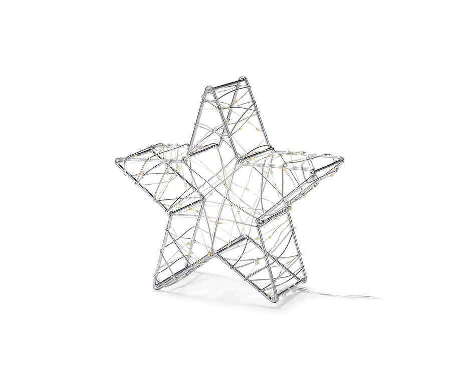 Egy kis LED-es dekorcsillag látható fehér háttér előtt.