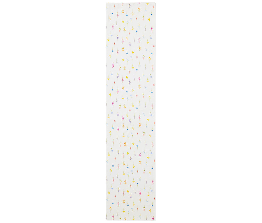 Asztali futó virágmintával sárga, kék, rózsaszín és piros színekben, fehér alapon.