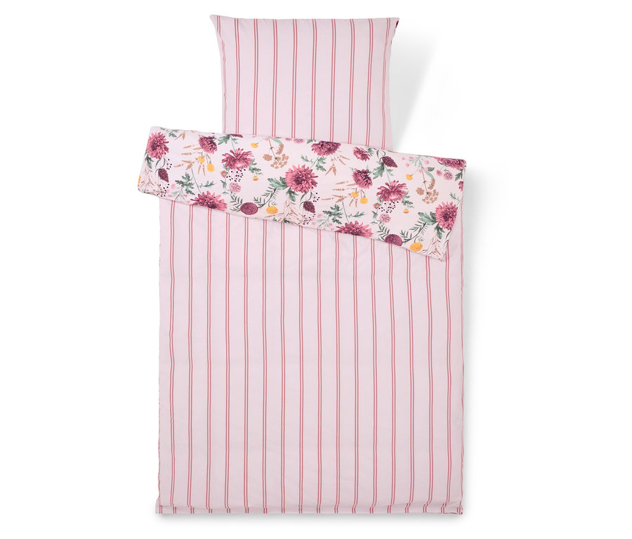 Ágynemű rózsaszín csíkokkal és virágmintával.