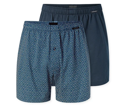 Két SCHIESSER jersey boxeralsó; az egyik kék, fehér rombuszmintás és gombos sliccel, a másik egyszínű sötétkék.