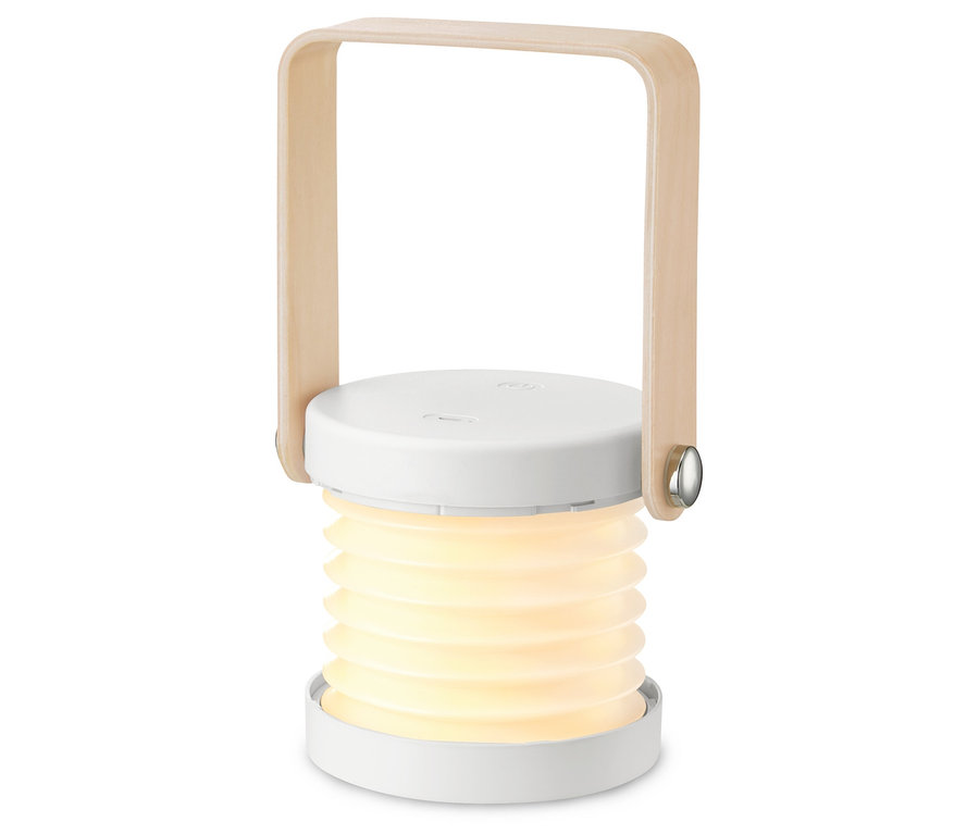 Egy összecsukható LED-es multifunkcionális lámpa világít fehér háttér előtt.